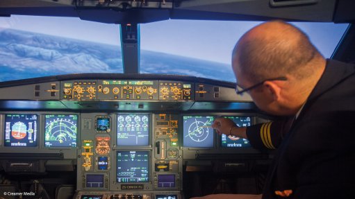 A pilot monitoring the navigation system on an SAA aircraft