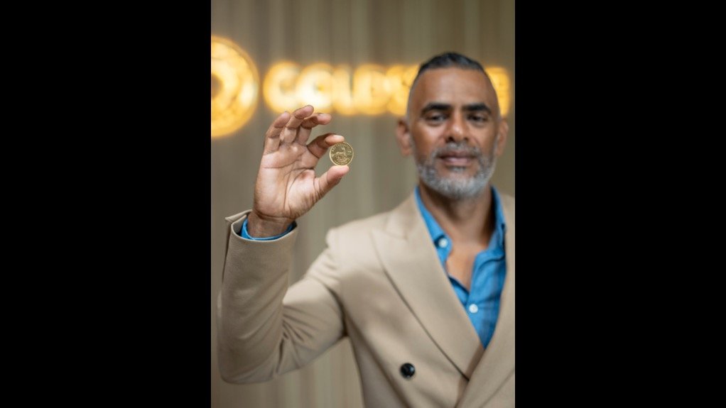 An image of SA Bullion co-CEO Imran O'Brien holding a gold coin