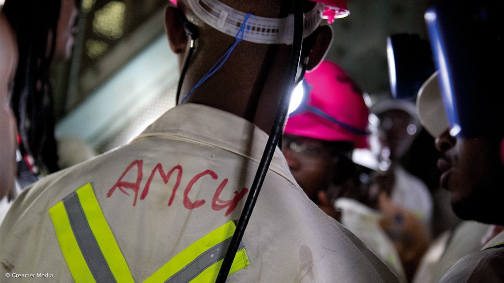 An underground mineworker labelled as an AMCU member
