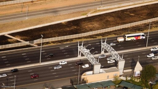 Aerial view of a GFIP highway and e-toll gantries