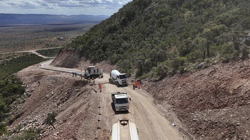 Construction of the first half of the concrete access road up the 18% incline towards the top of the mountain to ensure safe access for the turbine components