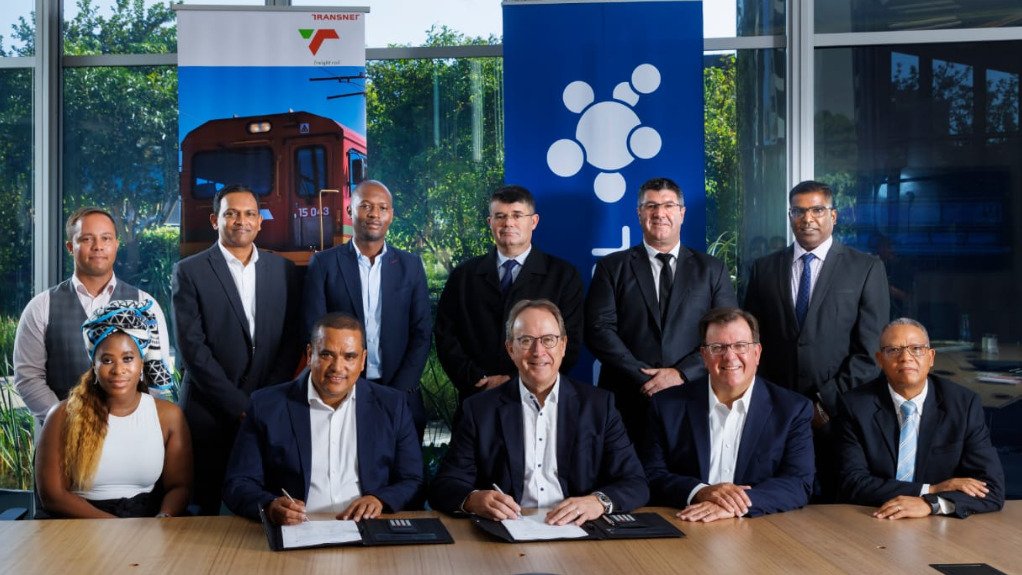 TFR acting CEO Russell Baatjies and Sasol CEO Fleetwood Grobler sign the agreement, alongside their respective teams