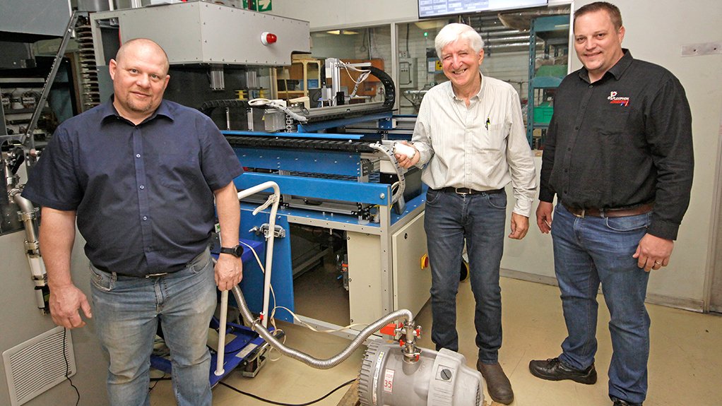  Together (from left) VI plant manager Danie Hanekom, his predecessor John Schultz and automation specialist Wes Allan devised and developed the ingenious automated VI testing system, in which a special trolley (shown here) for carrying VIs for testing is plugged into one of the test stations.