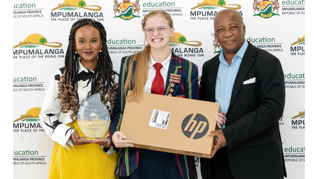 An image of learners receiving an award for being top achievers