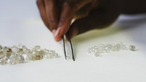 A De Beers employee sorting rough diamonds