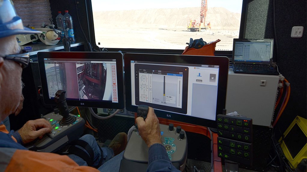 An operator controls rigs at a remote operator station