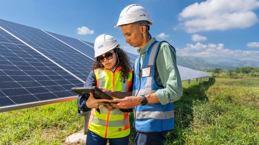 The above image depicts two JUWI technitians inspecting the data of the solar plant