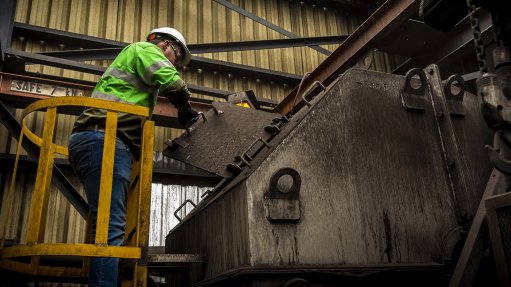 Izak Potgieter, Systems Manager at Weba Chute Systems, inspecting a transfer chute at a coal mine