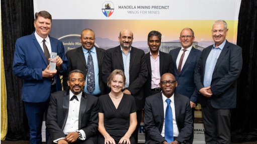 A group of executives that represent the Mandela Mining Precinct in a photo together at their 5 year anniversary 