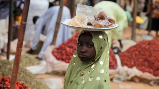 A child selling food items in Nigeria