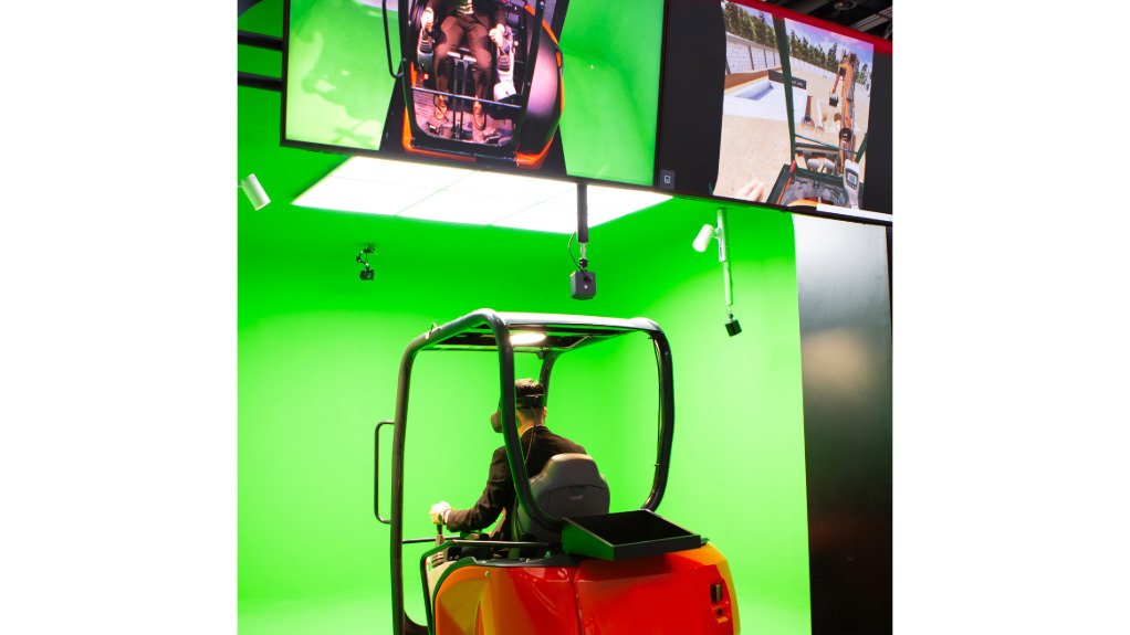 An image of a trainee in an excavator virtual simulation system