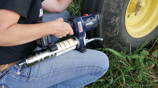 Image of a lubrication system being used on a farm vehicle tyre