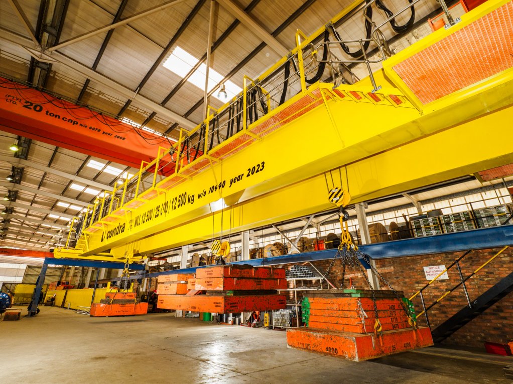 Image of Saiccor Mill’s 12.5/25/12.5 t overhead travelling crane under factory load test before delivery