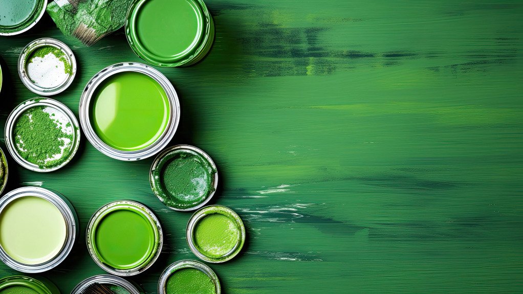 A group of paint cans in different shapes but all various shades of green