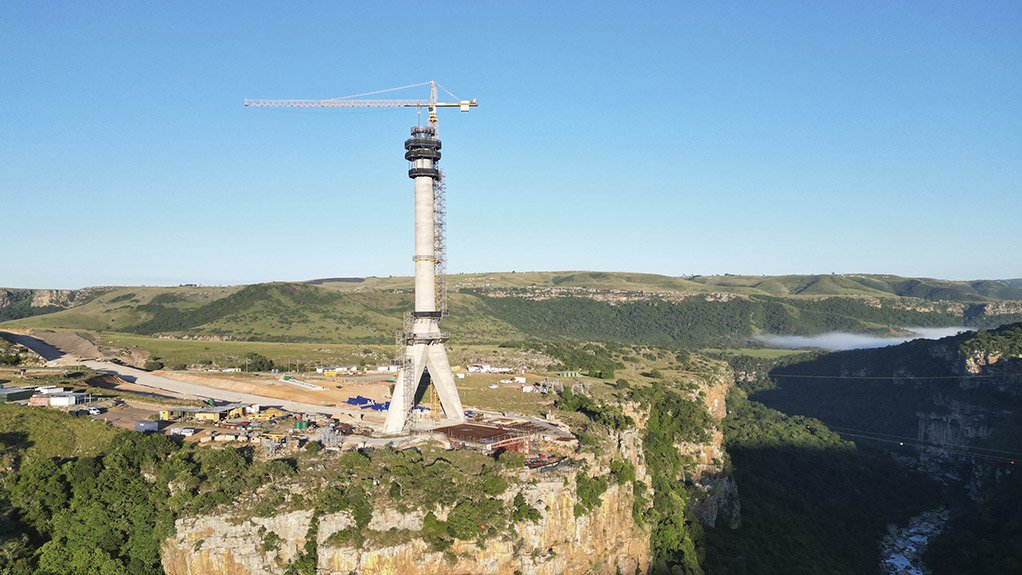 The pylon spires of South Africa's Msikaba Bridge mega project are on their way up, soon to tower almost 130 metres high at each side of the near 200m deep river gorge
