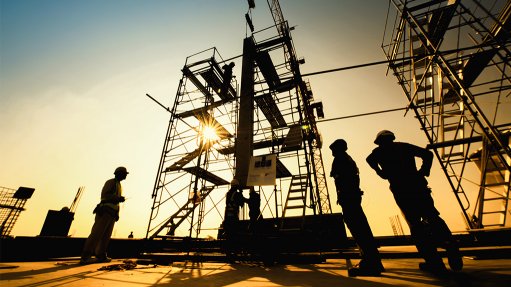 Silhouette of construction site and workers