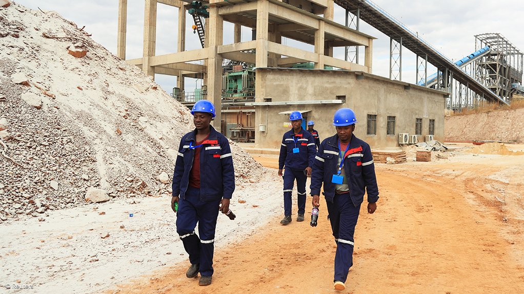 Employees on site at a lithium mine in Zimbabwe