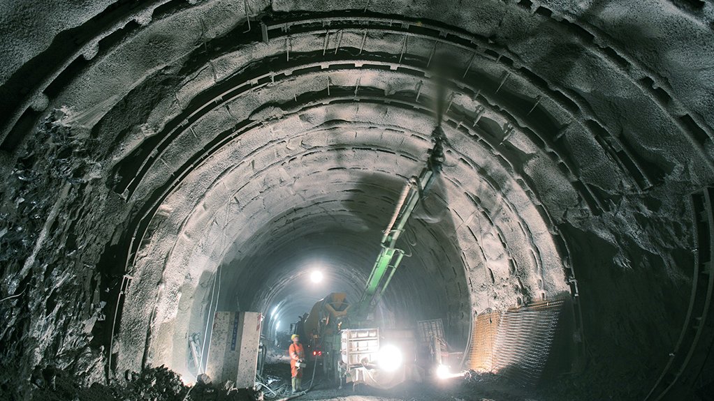 Image of fibre reinforced shotcrete being applied in an underground tunnel