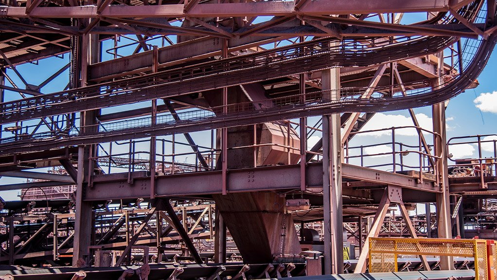 A Weba conveyor onto conveyor transfer chute at an iron ore mine