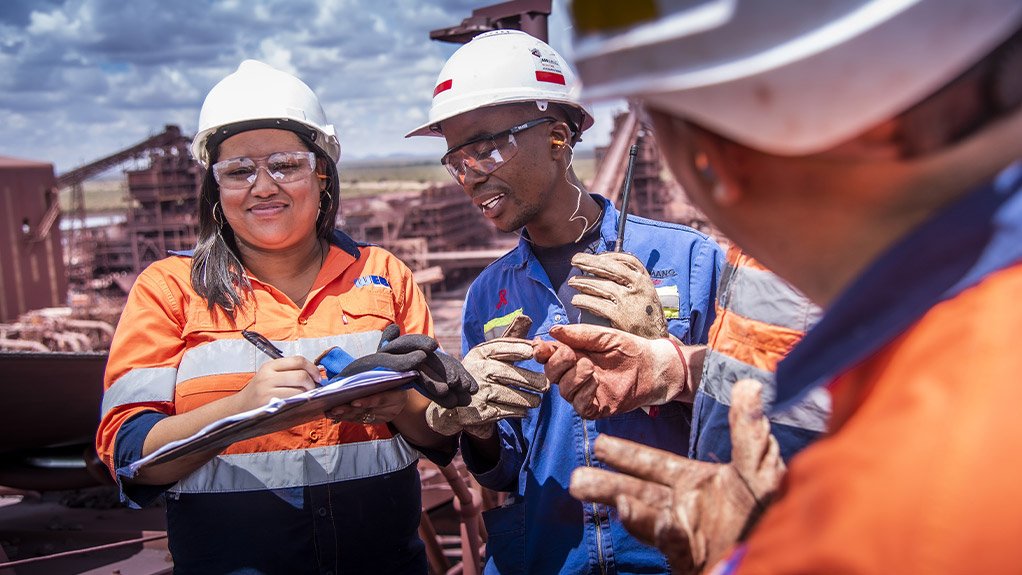 Weba Chute Systems site team consulting with the customer at an iron ore mine