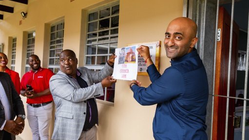 From left, Mr Majola, principal of Ningizimu Special School), with Theolan Govender, AfriSam Regional Manager, officially open the new classrooms

