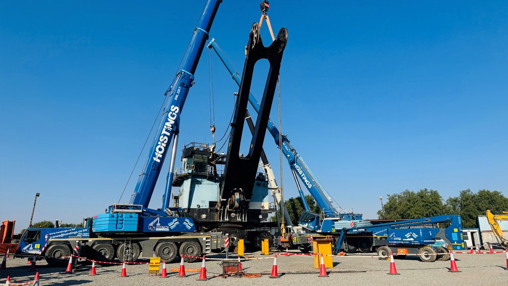 HEAVY UNDERTAKING Such is the size of the electric rope shovels used at the Jwaneng mine that two cranes can be seen here removing components to be refurbished as part of the major service procedure