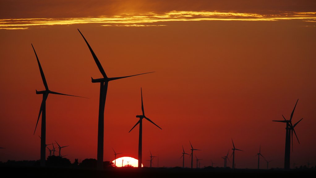 Image of silhouette of wind turbines