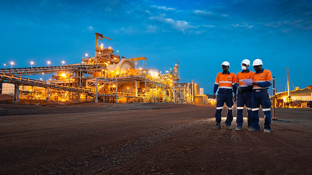 three miners at a Resolute Mining site