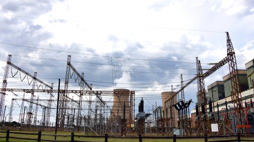 An image of an Eskom substation and cooling towers