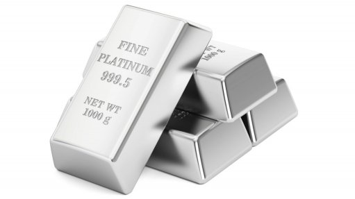 Four large bricks of platinum on a white background