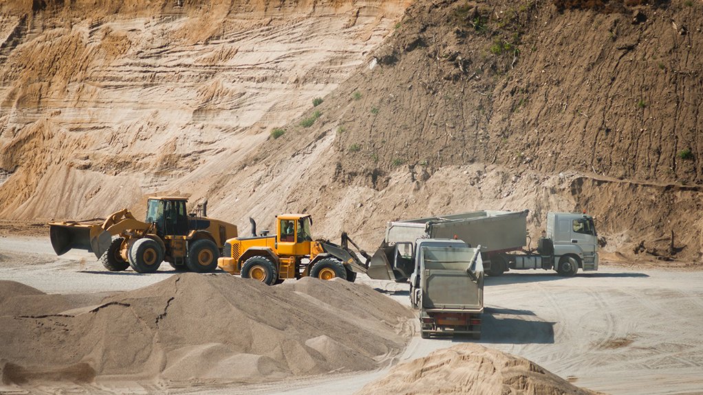 Image of heavy duty vehicles moving sand