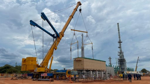 Rigging the first WEG E-house pod into position on site