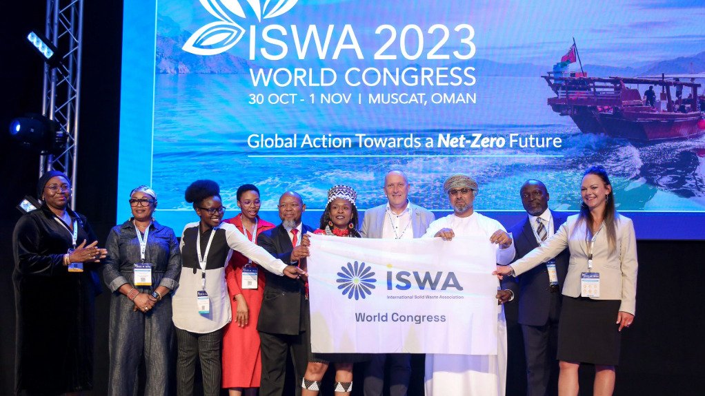 A picture of dignitaries holding up a banner at last year's ISWA 2023 Congress