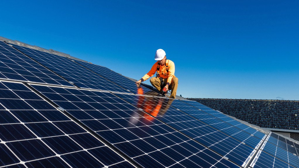 AN image of a solar panel technician