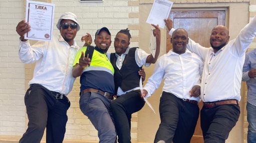 Members of the local community in Noupoort celebrate their hard earned success after graduating as concrete hands and shutterhands following training done by Concor during construction of the Koruson 1 Cluster project

