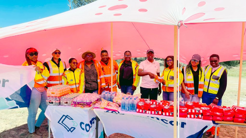 Concor employees are seen with the Deputy Principal of Eureka Intermediate School at the Umsobomvu Circuit Athletics Day held at the Simphiwe Ntsizakalo Stadium in Noupoort where the company sponsored refreshments for participating learners from Eureka Intermediate School

