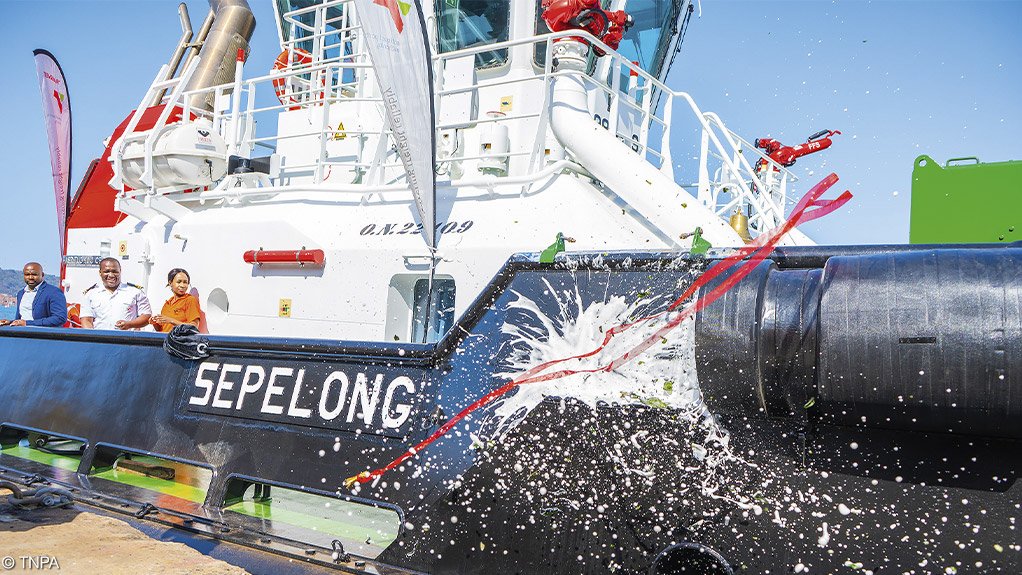 

TUG CHRISTENING: A bottle of bubbly being smashed against the side of the Sepelong, one of five new tugboats christened at a ceremony held at the Port of Durban earlier this month. The vessels form part of Transnet National Port Authority’s (TNPA’s) R1-billion marine fleet renewal programme, which has raised the number of tugboats at the Port of Durban to 14 in a fleet of 38 across eight commercial seaports. Photograph: TNPA
