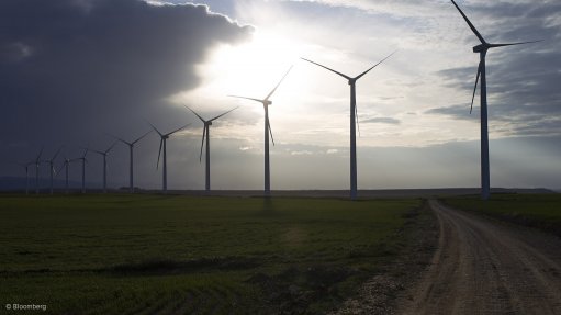 Image of wind turbines with sun in the background