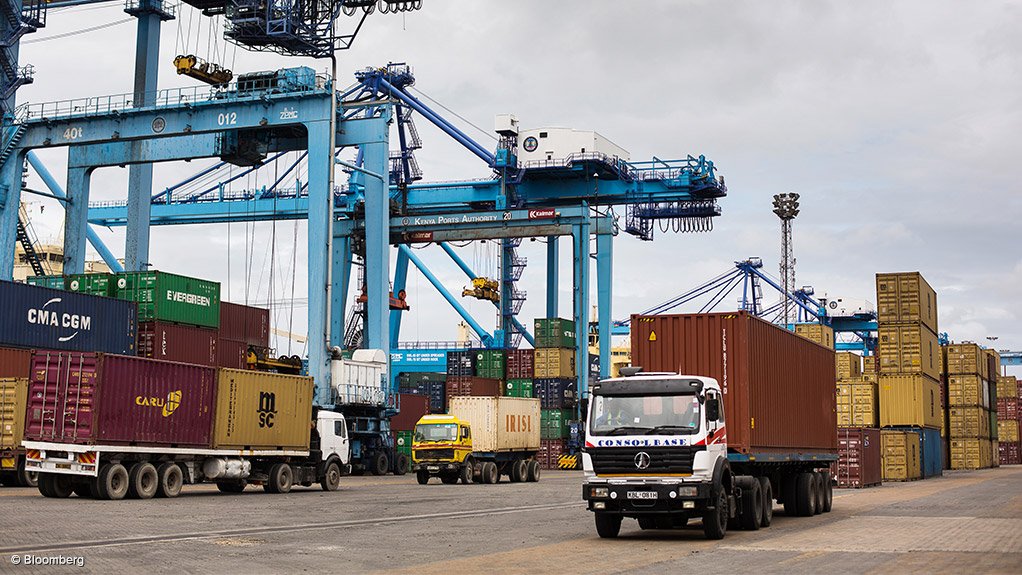 Trucks transporting cargo containers at a port in Africa