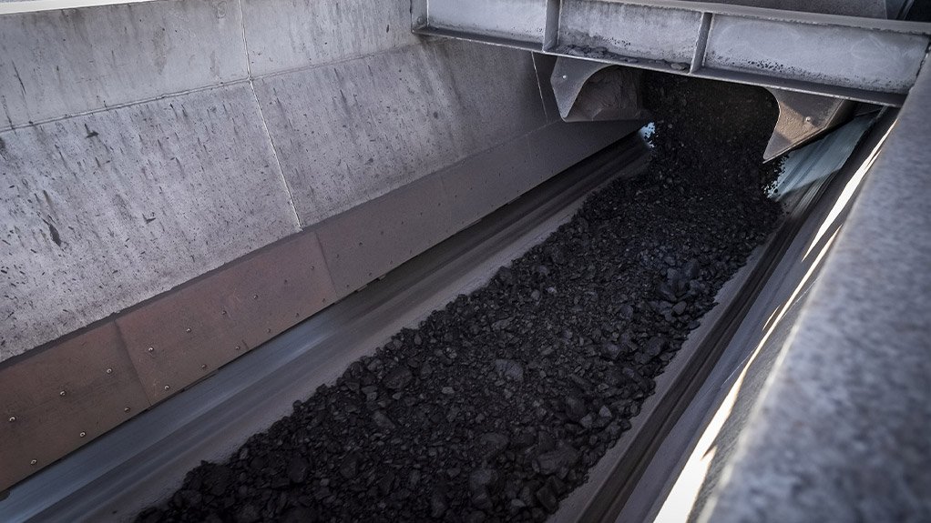 Material being fed onto an outgoing belt in a coal application, demonstrating the importance of correct chute design