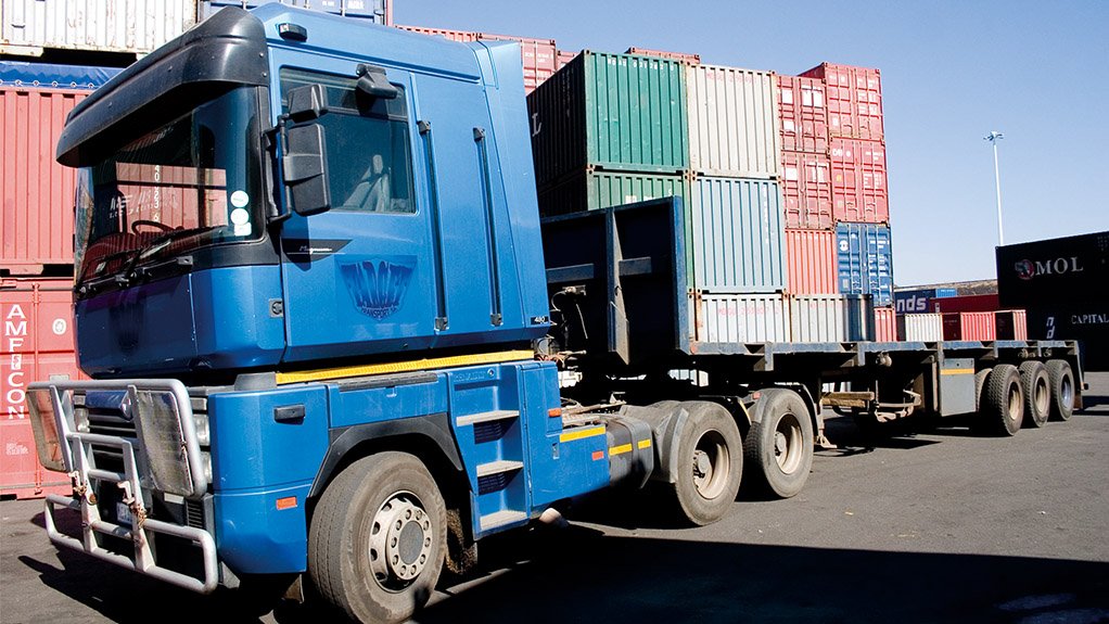 A truck transporting containers