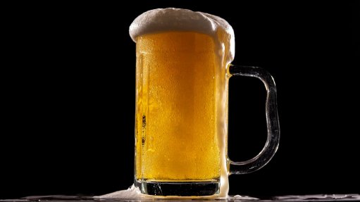 beer in glass mug with foam