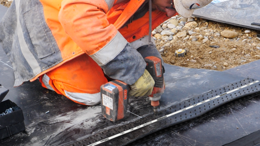 An image of a worker installing the Super-Screw