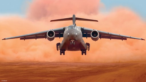 A C-390 takes off from an unpaved runway