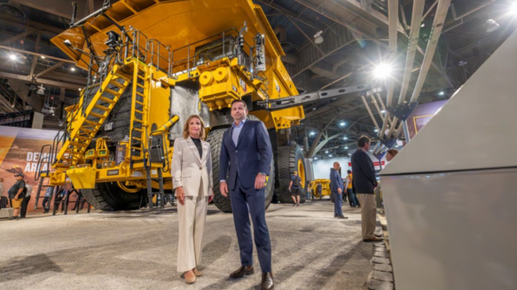 Caterpillar's Denise Johnson with BHP's Ragnar Udd in front of the Cat 798.