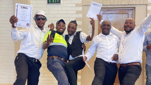 Members of the local community in Noupoort celebrate their hard earned success after graduating as concrete hands and shutterhands following training done by Concor during construction of the Koruson 1 Cluster project.