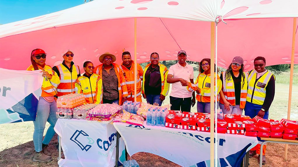 Concor employees are seen with the Deputy Principal of Eureka Intermediate School at the Umsobomvu Circuit Athletics Day held at the Simphiwe Ntsizakalo Stadium in Noupoort where the company sponsored refreshments for participating learners from Eureka Intermediate School.