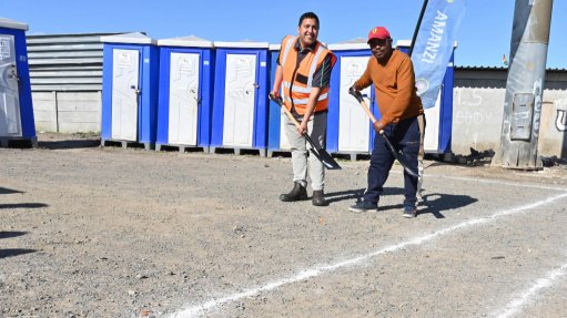 Image of City of Cape Town Mayoral Committee Member for Water and Sanitation councillor Zahid Badroodien with community leader Mthuthuzeli Mhleli at the site handover in the Nyagatisa Informal Settlement in Macassar