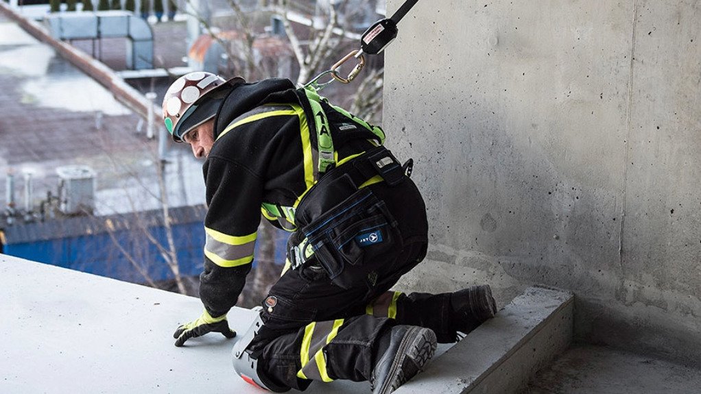 The above image depicts a person  in a harness 