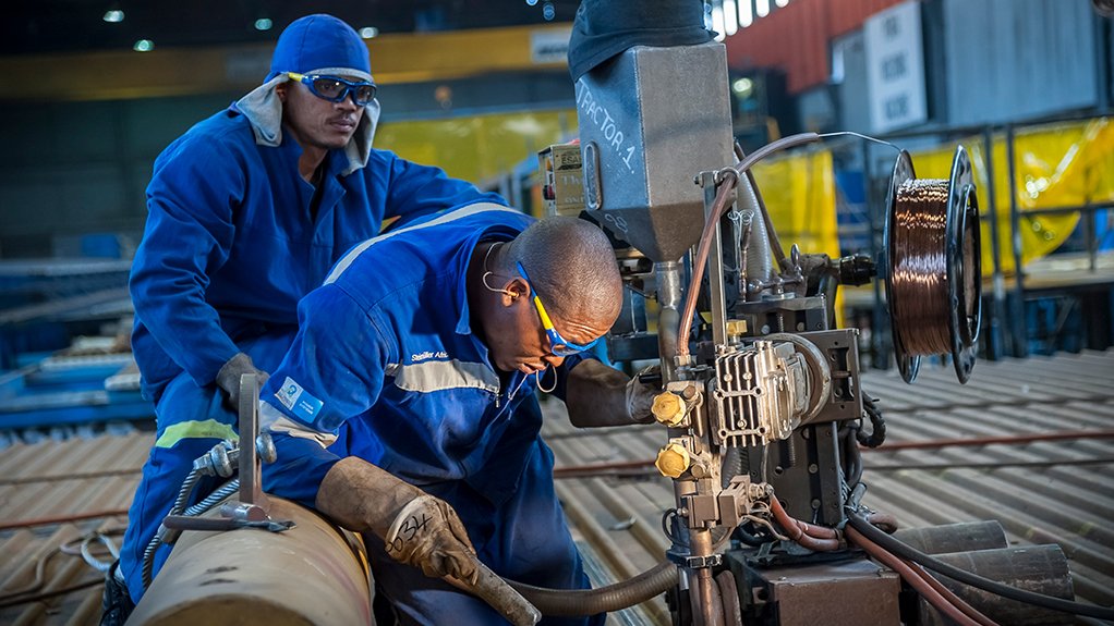 Image of technicians welding